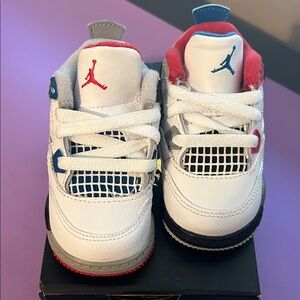 Jordan 4 Retro TD in White, Blue, and Red “What The”